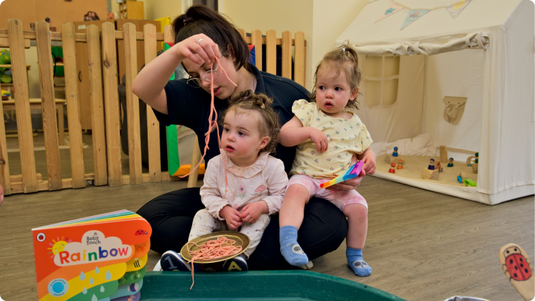 Babies playing with sensory items at the Poppies Tidworth Nursery